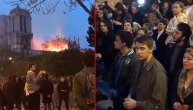 Vernici gledajući užareni Notr Dam klekli na asfalt i otpevali molitvu
