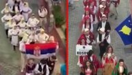 Mali Srbi i Albanci idu istom ulicom i nose zastave Srbije i tzv. Kosova