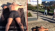 Novi hit video iz Novog Sada: Mladić raširio peškir i sunča se ispred tržnog centra