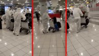 Kineski turisti na aerodromu "Nikola Tesla" privukli pažnju svima: Primer ekstremnog poštovanja mera