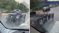Luda scena u Beogradu, čovek vozi kabriolet po kiši